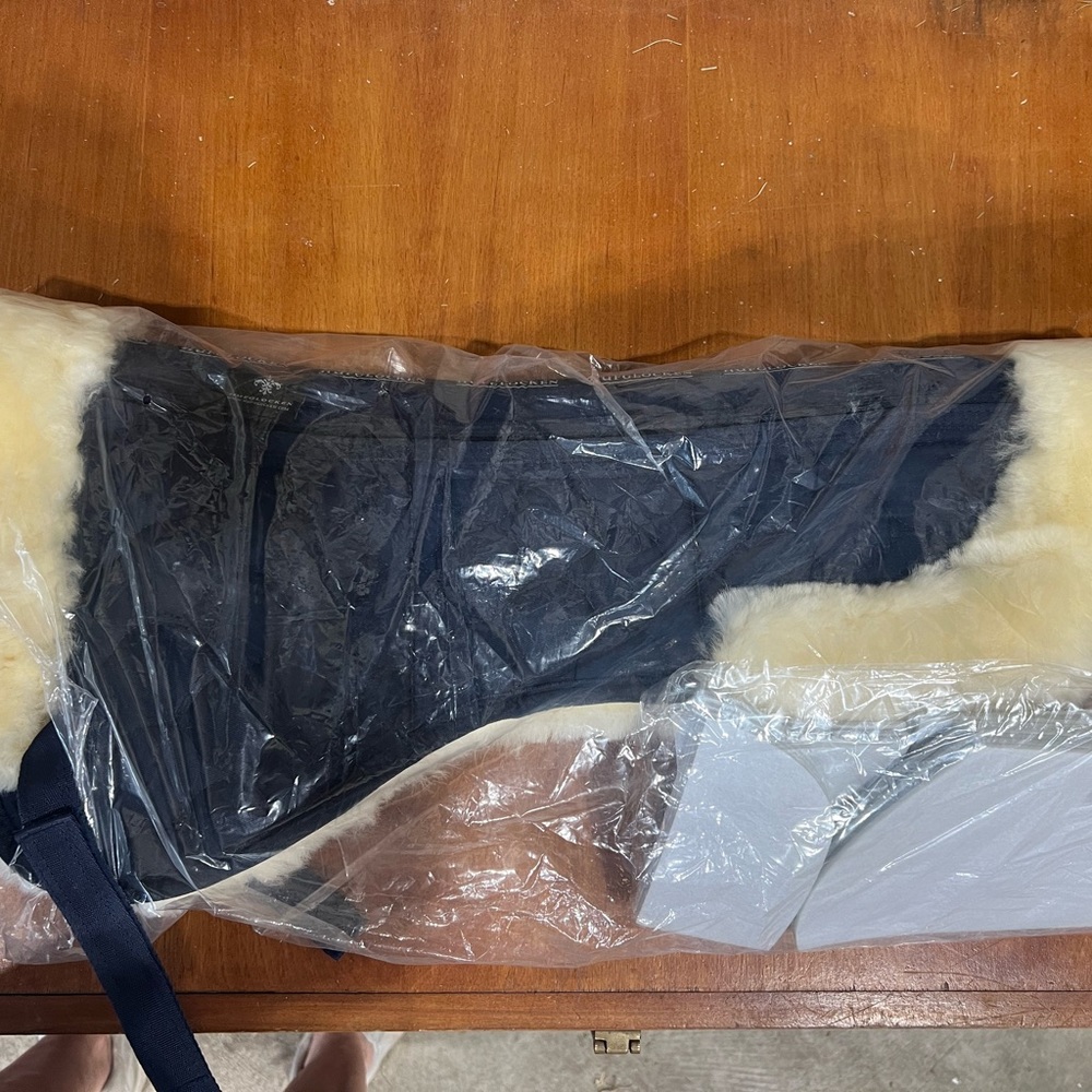 Sheep skin half pad. Brand new. Never put on a horse